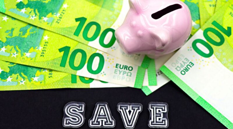 A piggy bank on euro bills with 'save' text highlights money saving concepts.